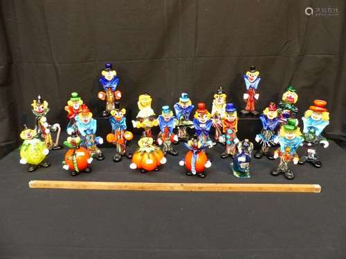 A collection of 20 clowns and a Murano glass dog. …