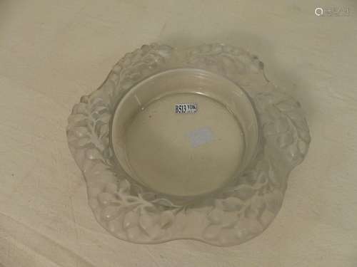 A moulded and pressed glass bowl with floral decor…