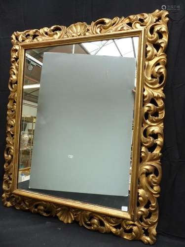 Carved and gilded wood mirror.