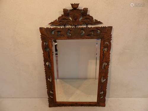 A rectangular oak mirror carved circa 1880/1900