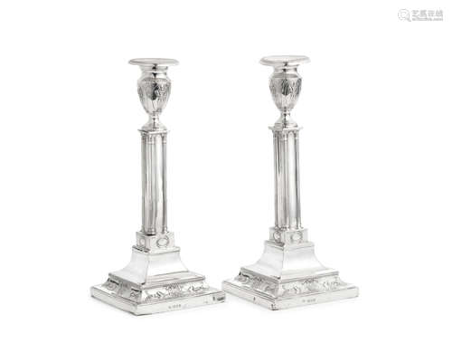 A pair of silver candlesticks Harry Freeman, London 1919