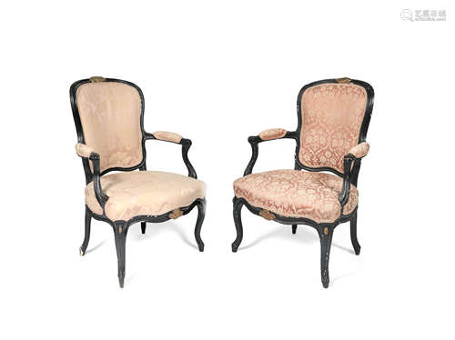 A pair of French 18th/19th century ebonised and parcel gilt fauteuils