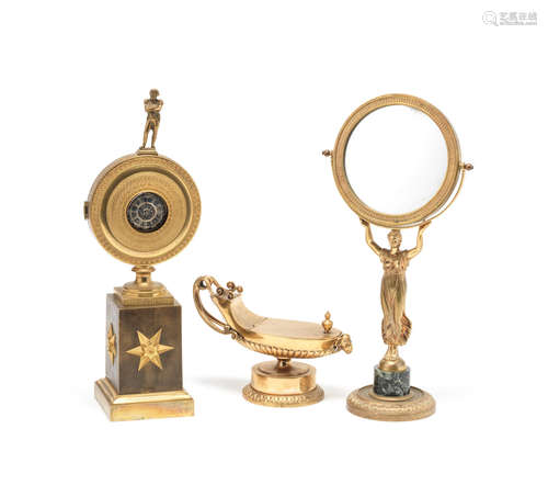 A late 19th/early 20th century French gilt bronze watch stand together with a similar period figural table mirror and a similar classical oil lamp inkwell