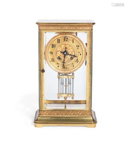 A late 19th / early 20th century gilt brass four glass clock the movement stamped Japy Freres, the dial signed Guichard, Chalon-sur-Saône