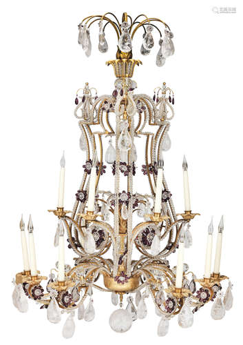 A gilt brass and cut and moulded clear and amethyst beaded glass and rock crystal fifteen light chandelier probably French or Italian, early 20th century,