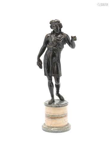 A late 19th / early 20th century patinated bronze figure of a Bacchic youth