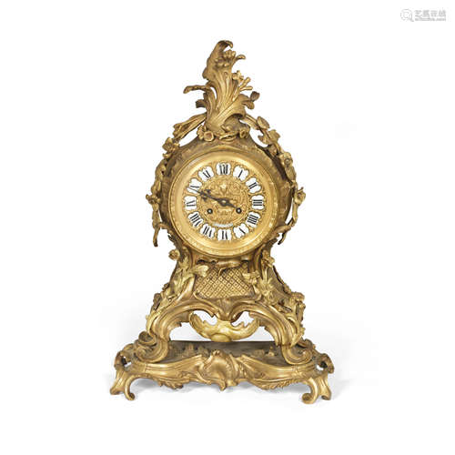 A late 19th century French gilt bronze mantel clock in the Louis XV style, the dial signed Raingo Freres