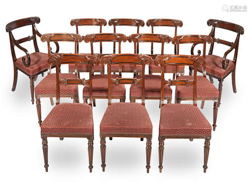 A set of eighteen mahogany and ebonised dining chairs in the Regency style