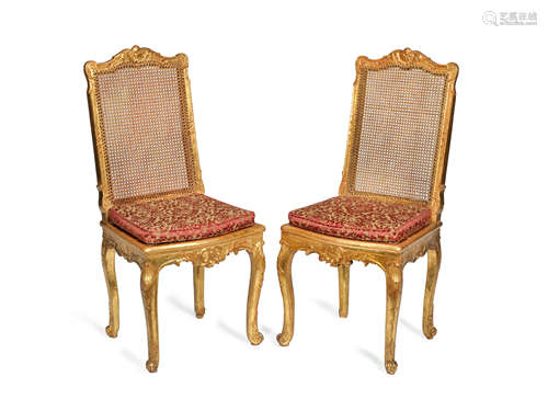 A pair of Louis Philippe giltwood salon chaises in the Regence style