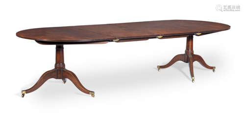 A late George III mahogany twin pedestal dining table