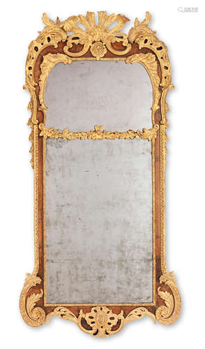 A 19th century walnut and parcel gilt mirror in the George II style