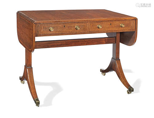 A Regency fiddleback mahogany and rosewood banded sofa table