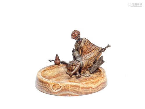 Franz Bergman (Austrian, 1861-1936): A cold painted bronze and Algerian onyx figural ashtray depicting an Eastern trader