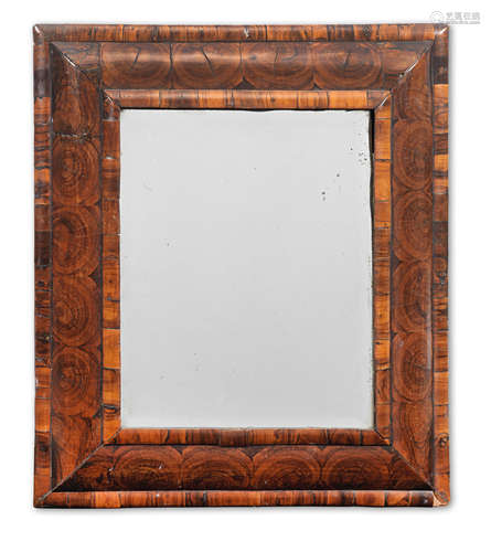 A William and Mary olivewood, oyster veneered 'cushion frame' mirror