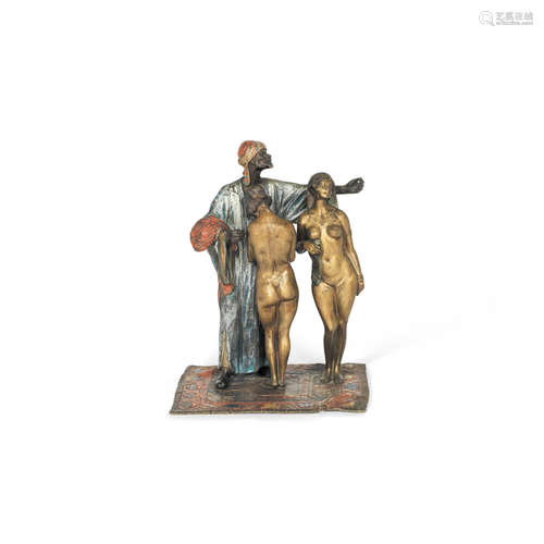 After Franz Bergman (Austrian, 1861 -1936): A cold painted bronze figural group of an eastern slave trader