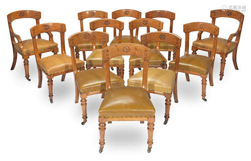 A set of twelve mid Victorian gothic revival oak dining chairs attributed to E.W. Pugin