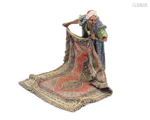 Frans Xaver Bergman (Austria, 1861-1936): A cold painted bronze figure of a middle eastern carpet seller