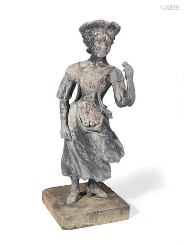 An attractive lead garden figure of a female fruit picker in 18th century dress in the manner of John Cheere (English, 1709-1787), circa 1910