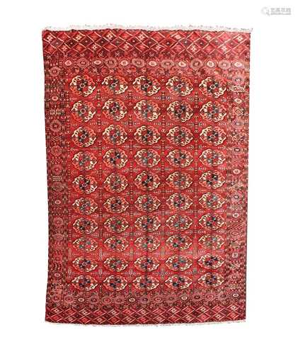 A Tekke carpet, Turkmenistan, circa 1890, the madder field with ten rows of five medallions,