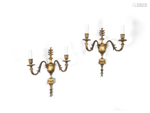 A pair of early 20th century gilt bronze twin light wall appliques in the Adam style