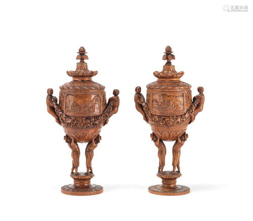 Two similar carved and turned stained lindenwood souvenir cups and covers