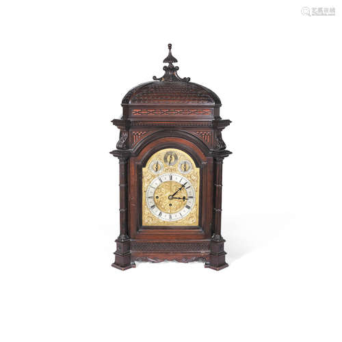 An impressive Continental late 19th / early 20th century carved and mahogany stained quarter chiming bracket clock