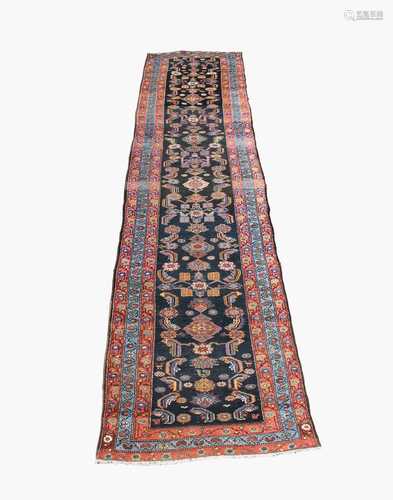 A Hamadan runner, North West Persia, the charcoal field with the all over herati pattern and