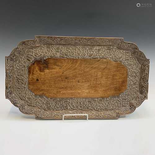 An Indian carved wood tray, early 20th century, the border with leafy tendrils and flowerheads, 33 x