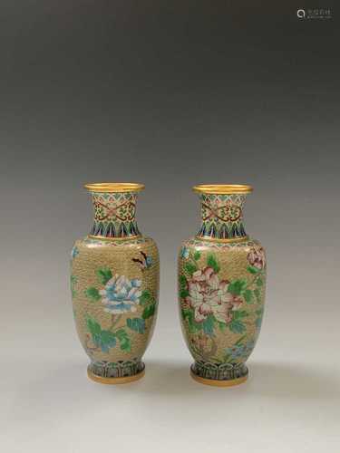 A pair of Chinese cloisonne vases, decorated with floral sprays and foliage, height `20.5cm.