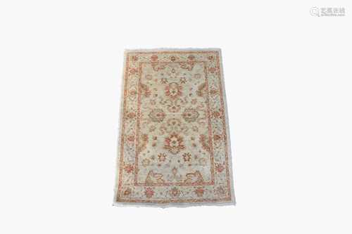 An Afghan Ziegler style rug, the ivory field with palmettes and flowering vines sprays, within an