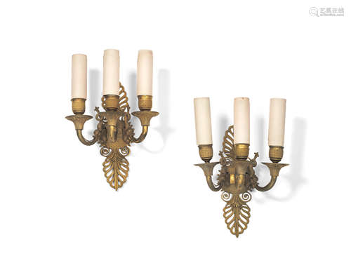 A pair of French Empire gilt bronze three light wall appliques