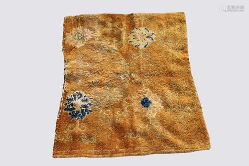 A Tibetan rug fragment, with four large flowerheads, 82 x 100cm.