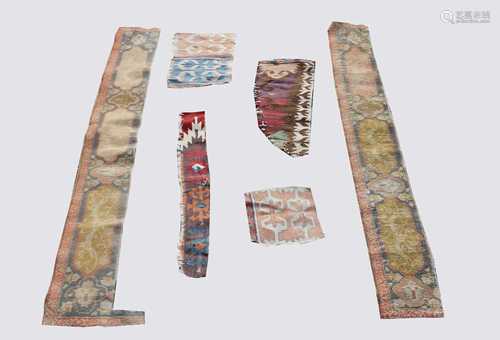 Turkish kelim fragments and Tabriz rug border fragments.