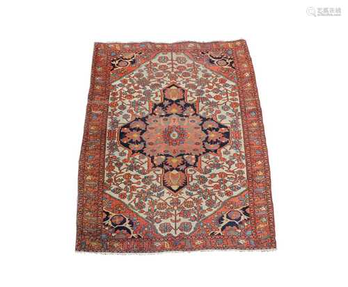 A Sarough rug, West Persia, the ivory field with an indigo central medallion, with palmettes and