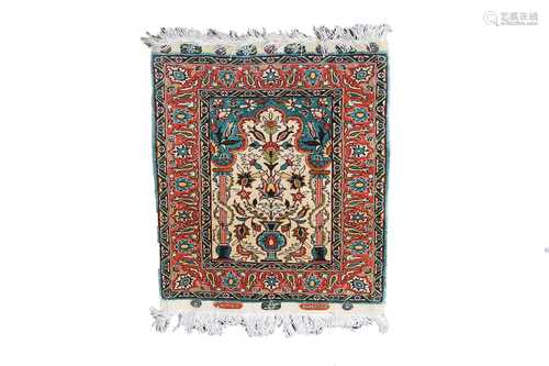 A Turkish silk mat, with label inscribed 'Istanbul-Cinar, Pure Silk', the ivory mihrab with a