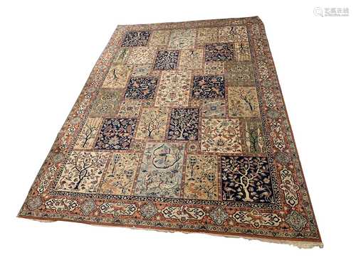 A machine made carpet, of Baktihari Persian design, the polychrome compartment field decorated