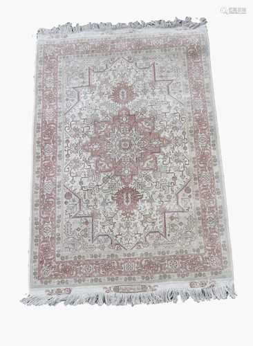 A Tabriz rug, North West Persia, signed cartouche to each end, the ivory field with a large