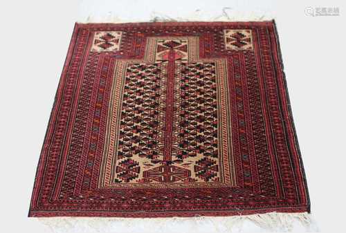 A Belouch prayer rug, the camel mihrab with polychrome guls and animals, within multiple border, 153