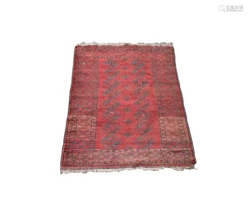 An Afghan rug, with eight rows of two octagonal medallions, within a linked diamond motif border,