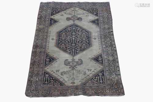 A Feraghan rug, North West Persia, the camel field with an indigo hexagonal pole medallion enclosing