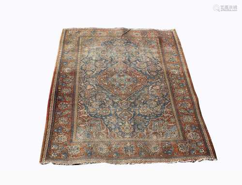 A Kashan rug, Central Persia, the indigo field with a polychrome central pole medallion with