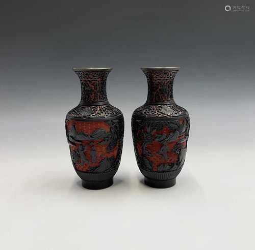 A pair of Chinese red and black carved cinnabar lacquer vases, 20th century, with figures in a