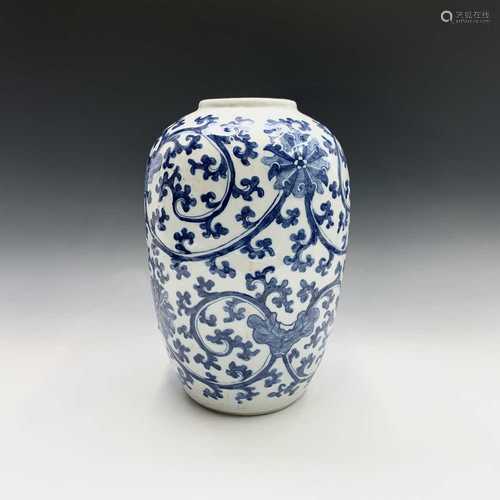 A Chinese blue and white jar, circa 1900, in Ming style, with flowerheads blossoming amongst