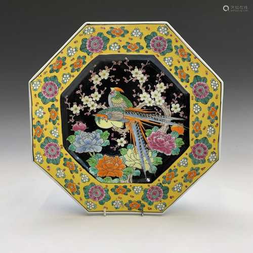 A Chinese porcelain octagonal charger, early 20th century, the central black ground with exotic