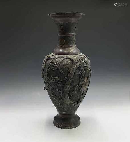 A large Japanese bronze vase, Meiji Period, with figures, birds, flowering branches and pagodas,