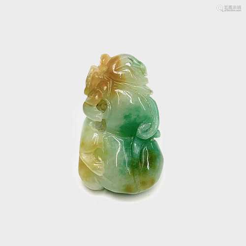 A Chinese jade pendant, in the form of a double gourd surmounted by a stylised animal, 4.5 x 2.5cm.