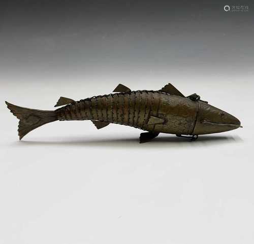 A Chinese brass articulated fish, circa 1900, the hinged head opening to reveal a section possibly