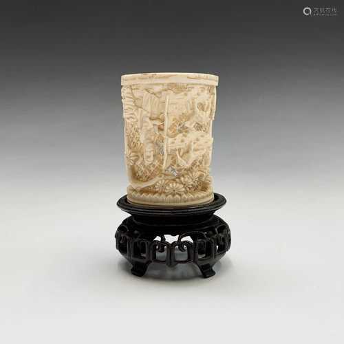 A Chinese Canton ivory carved tusk vase, late 19th century, on a wood stand, total height 10.8cm.