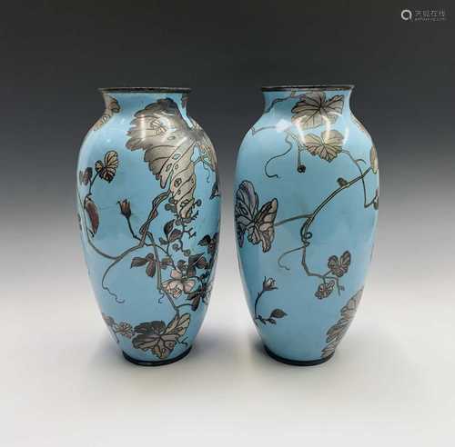 A pair of Japanese cloisonne vases, 19th century, each with a pale blue ground with birds perched on