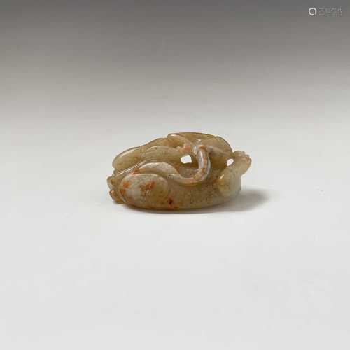 A Chinese carved jade figure of a feline, with reddish veining, Qing dynasty, height 2cm, width 5.